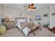 Bedroom displaying neutral tones, a ceiling fan, and arched window with shutters at 250 Freeport Ct, Punta Gorda, FL 33950
