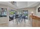 Bright breakfast nook featuring a table with seating and a view of the pool area at 250 Freeport Ct, Punta Gorda, FL 33950