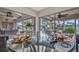 Bright breakfast nook featuring a glass-top table and views of the pool and lanai at 250 Freeport Ct, Punta Gorda, FL 33950