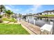 Modern dock on the canal featuring a boat lift and easy access to waterfront activities at 250 Freeport Ct, Punta Gorda, FL 33950