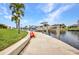 Canal-front property with a private dock and lift, perfect for boating and kayaking at 250 Freeport Ct, Punta Gorda, FL 33950