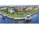 Waterfront home featuring lush landscaping, boat lifts, and a private dock, perfect for enjoying waterfront living at 250 Freeport Ct, Punta Gorda, FL 33950