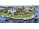 A beautiful waterfront home boasts a meticulously maintained lawn, a private dock, and multiple boat lifts at 250 Freeport Ct, Punta Gorda, FL 33950