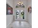 Welcoming foyer with decorative front doors and stylish tile flooring at 250 Freeport Ct, Punta Gorda, FL 33950