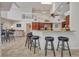 Spacious kitchen featuring an island bar with seating and an open view to the home's second story at 250 Freeport Ct, Punta Gorda, FL 33950