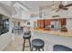 Spacious kitchen featuring an island bar with seating and an open view to the home's second story at 250 Freeport Ct, Punta Gorda, FL 33950