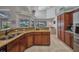 Gourmet kitchen with granite counters, stainless steel appliances, and backyard view at 250 Freeport Ct, Punta Gorda, FL 33950