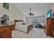 Spacious primary bedroom with vaulted ceiling and views of the pool at 250 Freeport Ct, Punta Gorda, FL 33950