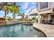 A luxurious pool and spa surrounded by lush landscaping, creating a serene and private retreat at 250 Freeport Ct, Punta Gorda, FL 33950