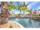 Resort-style pool area with rock features and lush tropical landscaping at 250 Freeport Ct, Punta Gorda, FL 33950