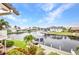 A scenic waterfront view featuring boats docked along the canal behind beautiful homes at 250 Freeport Ct, Punta Gorda, FL 33950