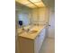 Bright bathroom featuring dual sinks, white cabinetry, and a large mirror at 26312 Deep Creek Blvd, Punta Gorda, FL 33983