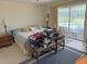 Bedroom with a pool view through sliding glass doors at 26312 Deep Creek Blvd, Punta Gorda, FL 33983