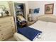 Bedroom featuring a dresser, side tables and comfortable bed at 26312 Deep Creek Blvd, Punta Gorda, FL 33983