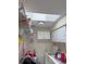 Convenient laundry room featuring washer, dryer, and storage cabinets at 26312 Deep Creek Blvd, Punta Gorda, FL 33983