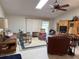 Spacious living room featuring a ceiling fan, a skylight, and neutral-colored walls at 26312 Deep Creek Blvd, Punta Gorda, FL 33983
