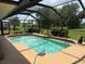 Enclosed pool area with a screened enclosure at 26312 Deep Creek Blvd, Punta Gorda, FL 33983
