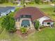 Aerial view of a single-Gathering home with a private pool in a well-manicured backyard at 264 Rotonda N Blvd, Rotonda West, FL 33947