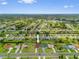 Wide aerial view of a neighborhood with well-maintained homes and green landscaping at 264 Rotonda N Blvd, Rotonda West, FL 33947