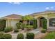 Charming home exterior with lush landscaping, stone accents, and a welcoming front entrance at 264 Rotonda N Blvd, Rotonda West, FL 33947