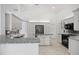 Modern kitchen featuring white cabinetry, granite countertops, and stainless steel appliances at 264 Rotonda N Blvd, Rotonda West, FL 33947