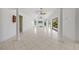 Spacious living room featuring tile floors, high ceilings, decorative columns, and an open layout perfect for entertaining at 264 Rotonda N Blvd, Rotonda West, FL 33947