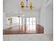 A living room shows an open layout with mixed flooring and fan, perfect for entertaining guests and Gathering at 264 Rotonda N Blvd, Rotonda West, FL 33947