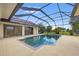 Screened-in pool area with a clear, sparkling pool and integrated spa, perfect for relaxation at 264 Rotonda N Blvd, Rotonda West, FL 33947