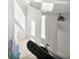 Bathroom with a pedestal sink and decorative glass sculpture at 3322 Sandpiper Dr, Punta Gorda, FL 33950