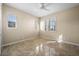 Neutral bedroom features a ceiling fan, tile floors and windows with white shutters at 3322 Sandpiper Dr, Punta Gorda, FL 33950