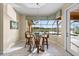 Cozy breakfast nook with waterfront view, tile floors, and lots of sunlight at 3322 Sandpiper Dr, Punta Gorda, FL 33950