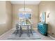 Elegant dining room with a chandelier and large window at 3322 Sandpiper Dr, Punta Gorda, FL 33950