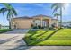Beautiful single-story home with a tile roof, well-kept lawn, and tasteful landscaping at 3322 Sandpiper Dr, Punta Gorda, FL 33950