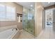 Spacious main bathroom features a soaking tub, glass shower, and natural lighting at 3322 Sandpiper Dr, Punta Gorda, FL 33950