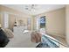 Serene main bedroom with access to the pool area and neutral color palette at 3322 Sandpiper Dr, Punta Gorda, FL 33950