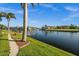 Beautiful waterfront view showcasing lush landscaping and canal access at 3322 Sandpiper Dr, Punta Gorda, FL 33950