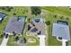 An overhead view of a home featuring solar panels, a pool and lush green surroundings in a serene neighborhood at 37 Pepe Ct, Punta Gorda, FL 33983