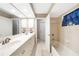Lovely bathroom features a double-sink vanity with ample counter space and a tub at 37 Pepe Ct, Punta Gorda, FL 33983