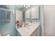 Bright bathroom showcasing a vanity with cabinet storage at 37 Pepe Ct, Punta Gorda, FL 33983