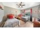 Bedroom featuring two twin beds, a ceiling fan and decor at 37 Pepe Ct, Punta Gorda, FL 33983