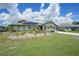 Charming home with well-manicured lawn, decorative garden, and solar panels, offering curb appeal at 37 Pepe Ct, Punta Gorda, FL 33983