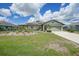 Charming home with solar panels and lush landscaping creates inviting curb appeal at 37 Pepe Ct, Punta Gorda, FL 33983
