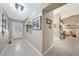 Bright and spacious hallway with neutral tones, tile flooring and decor that creates a welcoming atmosphere at 37 Pepe Ct, Punta Gorda, FL 33983