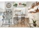 Charming kitchen bar with two stools, open to adjacent kitchen with stainless appliances at 37 Pepe Ct, Punta Gorda, FL 33983