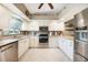 Modern kitchen with stainless steel appliances, ample cabinet space and stylish countertops, perfect for cooking at 37 Pepe Ct, Punta Gorda, FL 33983