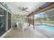 Outdoor lanai featuring a ceiling fan, roll down shades, and a clear view of a pool at 37 Pepe Ct, Punta Gorda, FL 33983