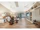 This expansive living room has hardwood floors and sliding glass doors to the pool at 37 Pepe Ct, Punta Gorda, FL 33983