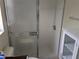 Bathroom features a standing shower with glass door at 4823 Foxhall Rd, North Port, FL 34288