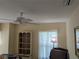 Bedroom with a ceiling fan and natural light from window at 4823 Foxhall Rd, North Port, FL 34288