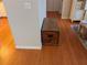 Hardwood hallway features a vintage wooden chest at 4823 Foxhall Rd, North Port, FL 34288